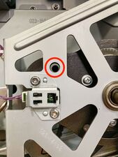 The position-B alignment hole on the main pulley will also be aligned (note that this image shows alignment after full reassembly).