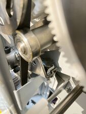 The damaged shock absorber itself is barely visible without disassembly (this image is also reference for the proper orientation of the bracket/holder).