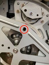 The position-B alignment hole in the second paper feed area (note that it lines up through both large white gears).