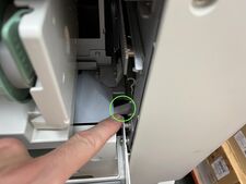 When pressed down, this small plastic hook will free the MMU to be pushed further into the riso.