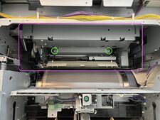 The 2 screws are on either end of a metal bracket on the MMU.