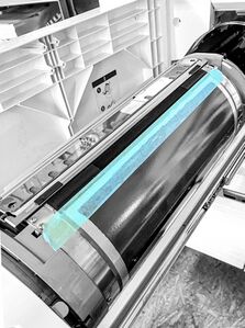 The barrier stencil taped down (leaving rubber strip uncovered).