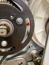 When correctly aligned, the single tooth on the main pulley will sit between the two teeth on the second paper feed gear.